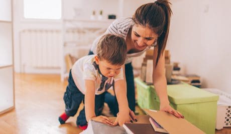 You child helping move furniture